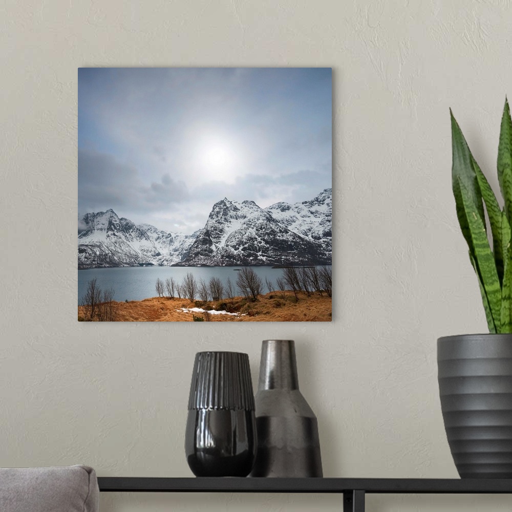 A modern room featuring Scenic photograph of snowy mountains and a lake under an overcast sky.