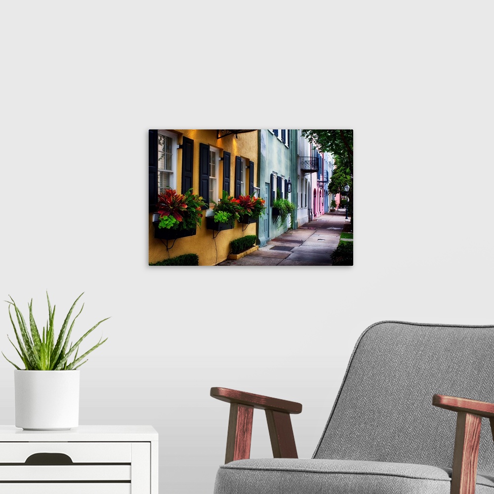 A modern room featuring Fine art photo of a shaded alley with colorful buildings in Charles, South Carolina.