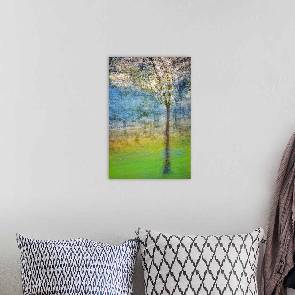 A bohemian room featuring Enhanced photograph of a blossoming tree, resembling a painting, from Ursula Abresch's Impression...