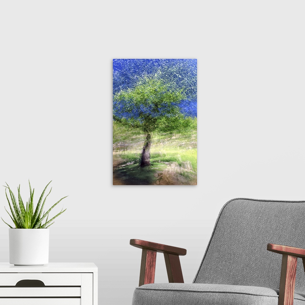 A modern room featuring Dream-like photograph of a tree with bright green leaves scattered into the air and movement on t...