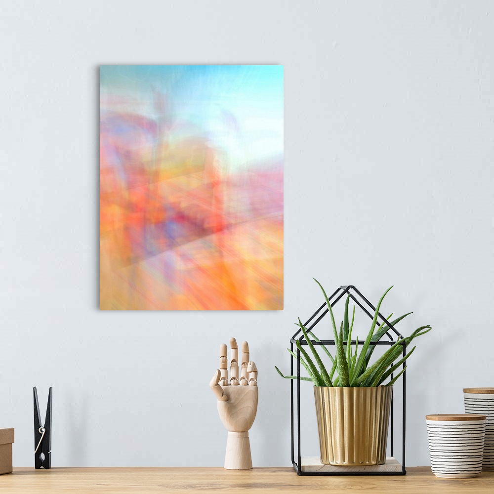 A bohemian room featuring An abstract image full of energy and movement in oranges, pinks, turquoise, blues, yellows and reds.