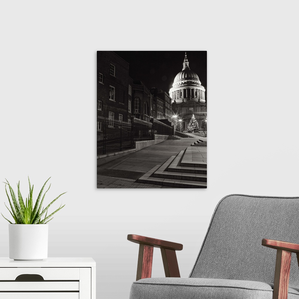 A modern room featuring A monochrome black and white night image of St. Pauls, London, England.
