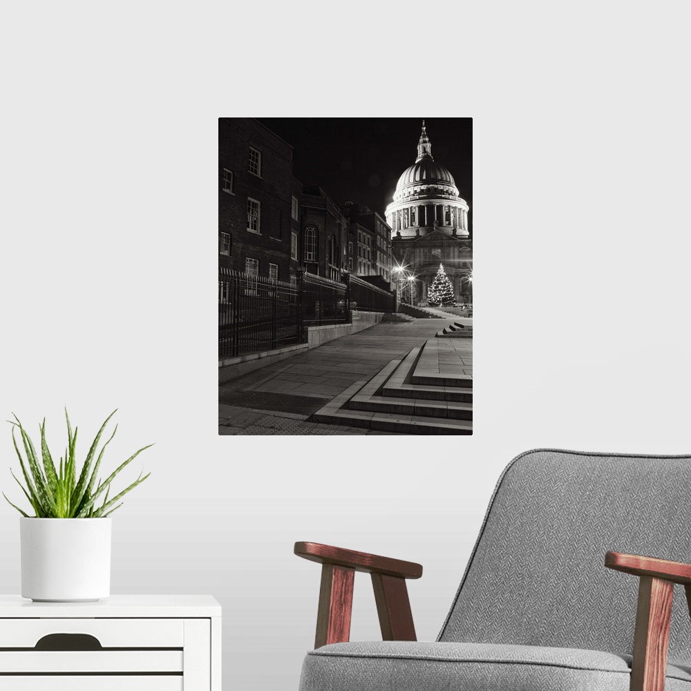 A modern room featuring A monochrome black and white night image of St. Pauls, London, England.