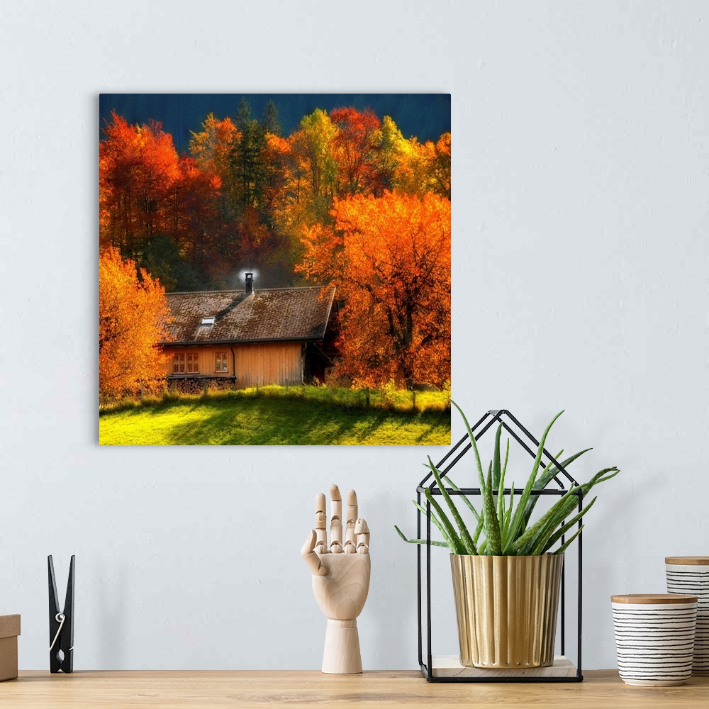 A bohemian room featuring Big artwork of a cabin with a smoking chimney in the woods in autumn as the leaves turn to their ...