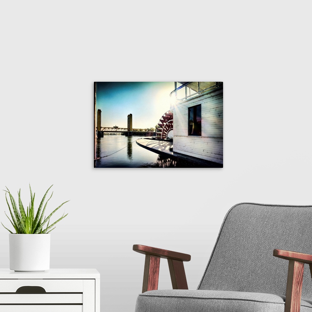 A modern room featuring A vignette photo of a steamboat and a drawbridge.