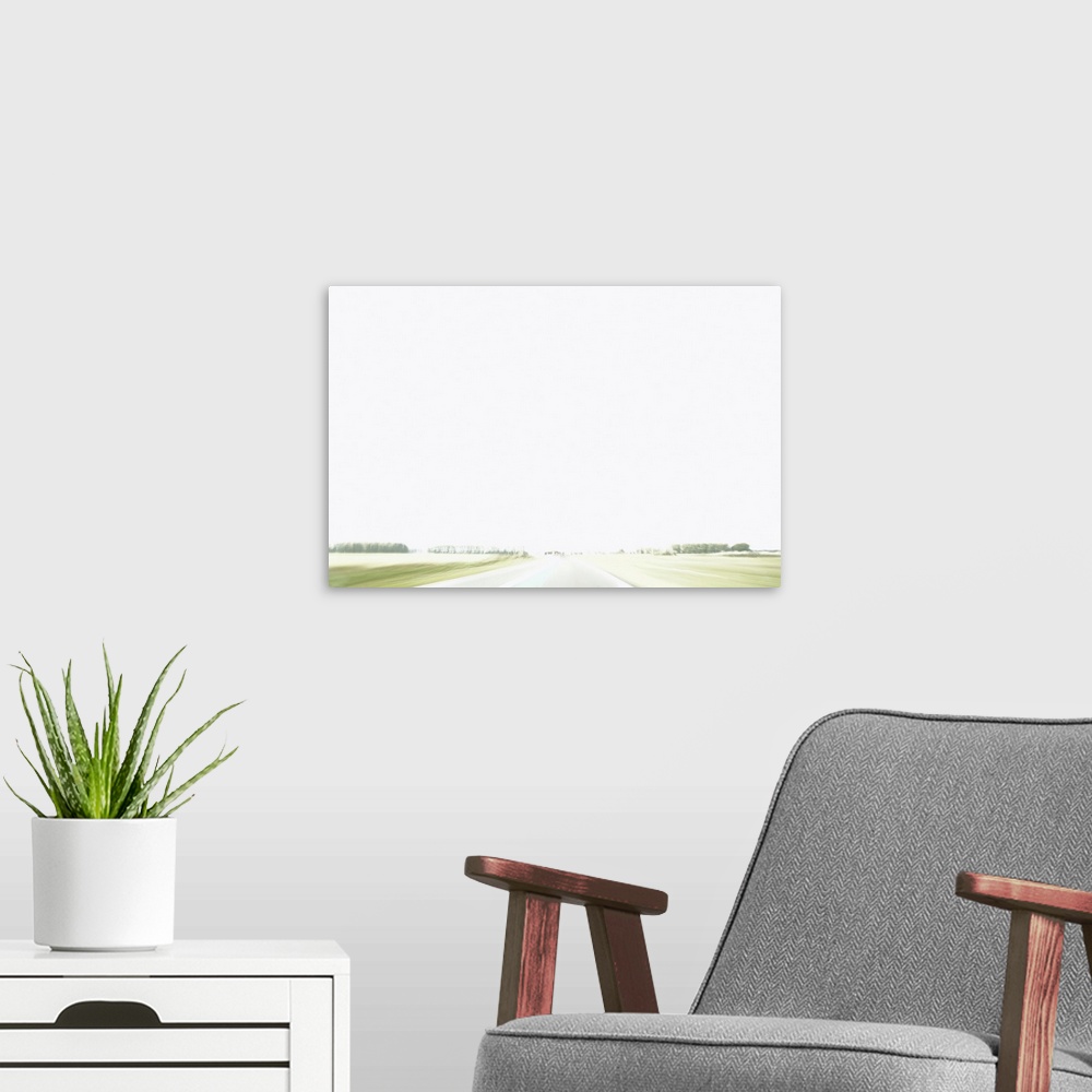 A modern room featuring A quiet road in a deserted polder landscape.