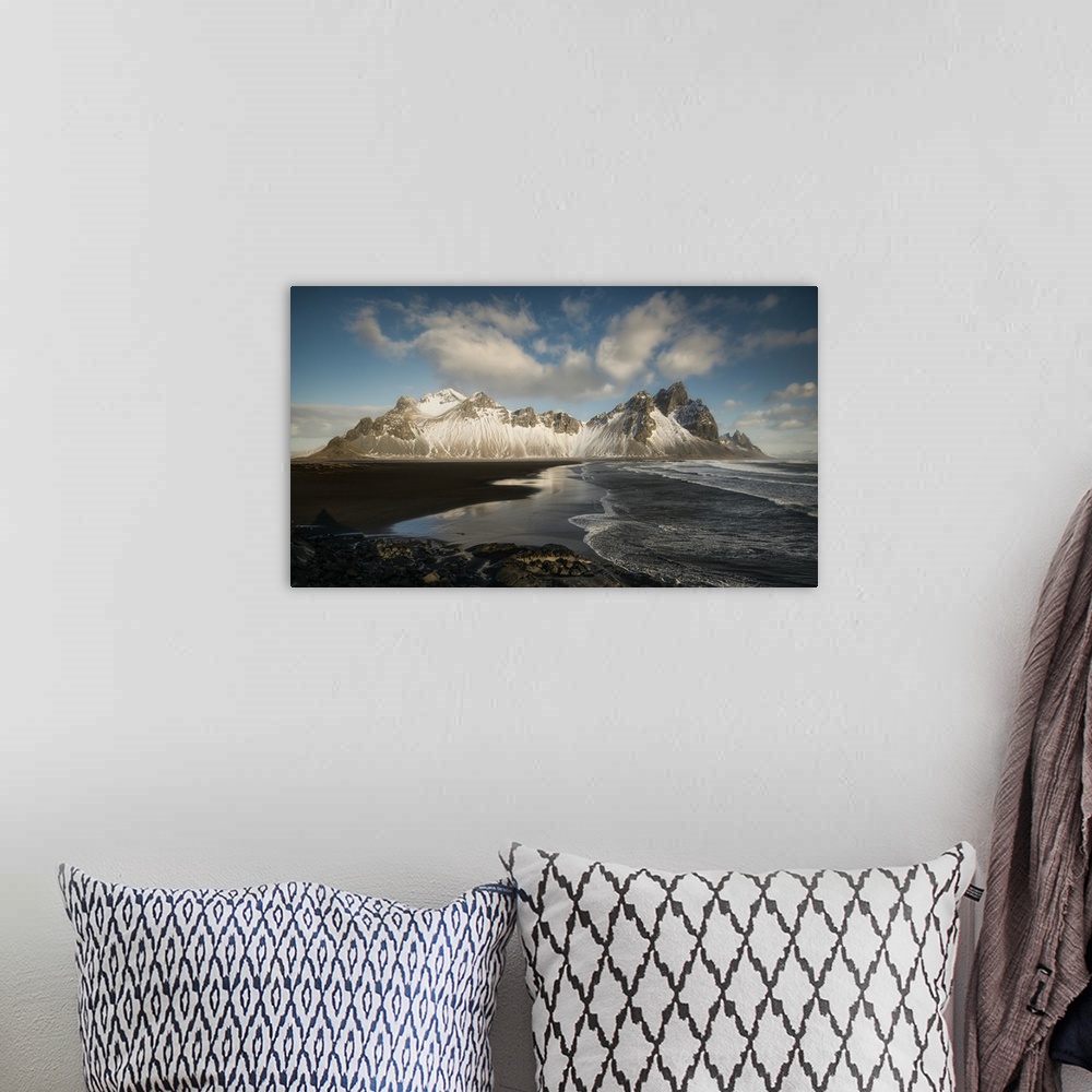 A bohemian room featuring Snow covered mountain at the edge of the ocean in Iceland.
