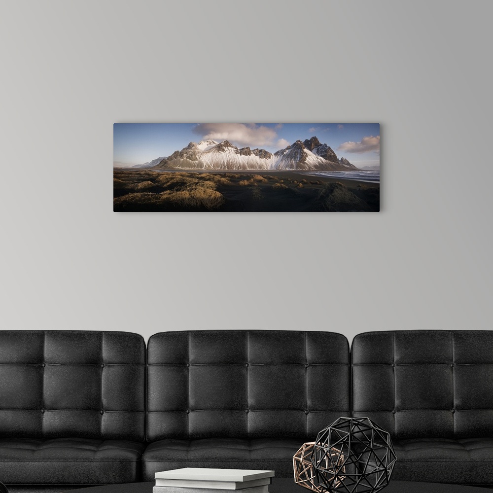 A modern room featuring Panoramic view of Vestrahorn mountain covered in snow, seen from the black sand beach, Stokksnes,...