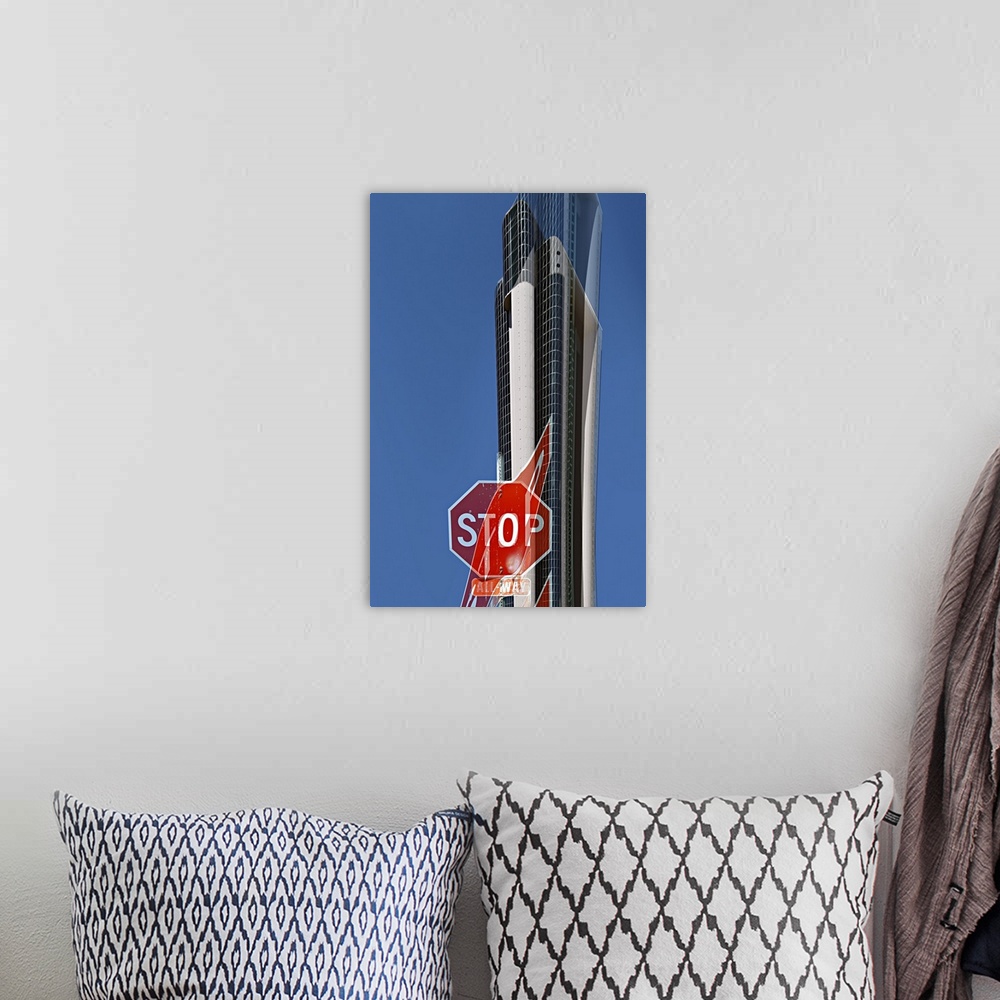 A bohemian room featuring Image of a stop sign and a skyscraper in the distance, with a warped version layered over it.
