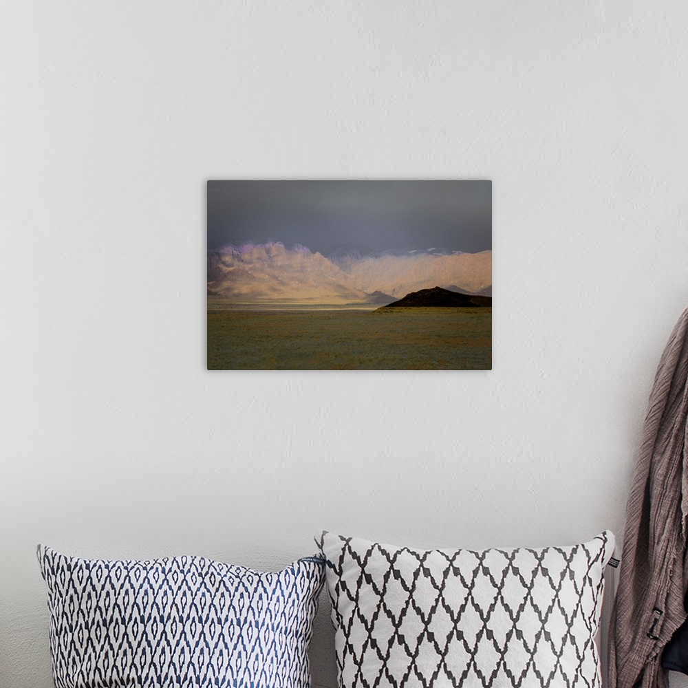 A bohemian room featuring Abstract photograph of a mountain landscape created with multiple layers.