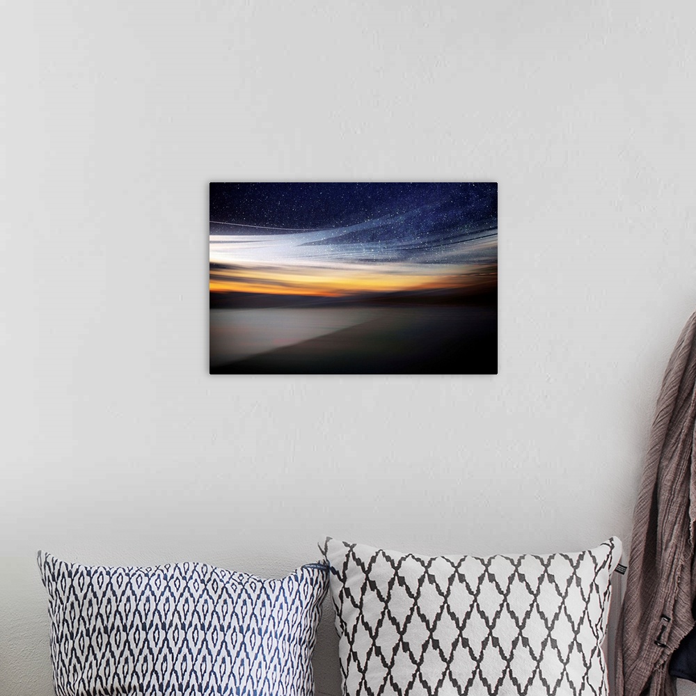 A bohemian room featuring Fine art photo of a starry night sky over the light of the setting sun from the coast.