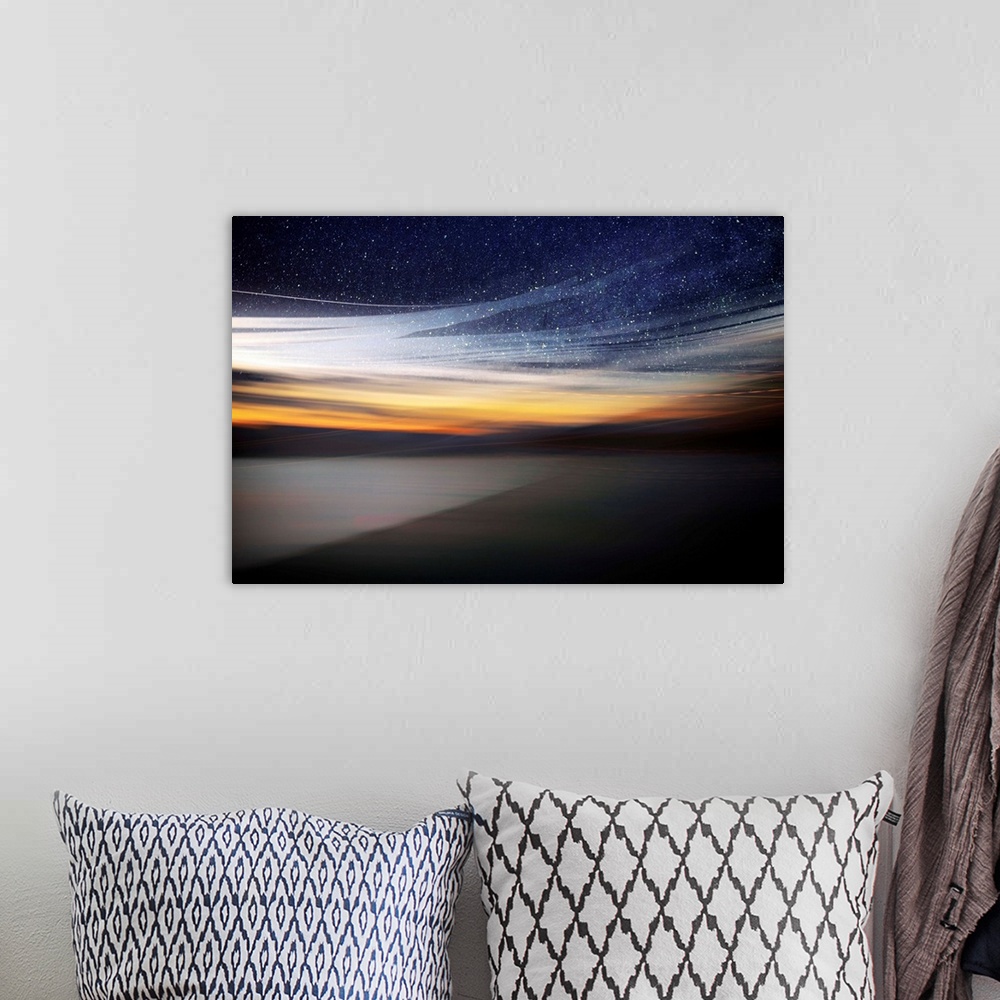 A bohemian room featuring Fine art photo of a starry night sky over the light of the setting sun from the coast.