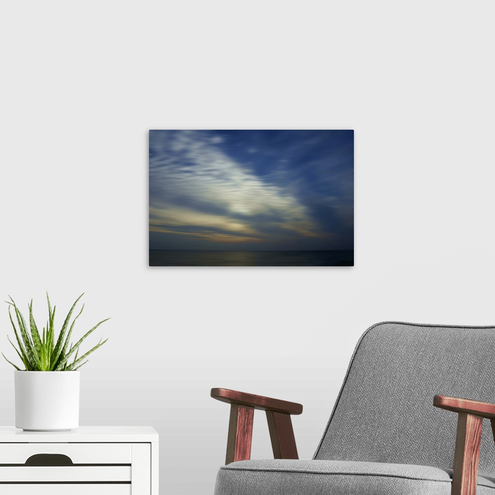 A modern room featuring Summer sunset above the North Sea