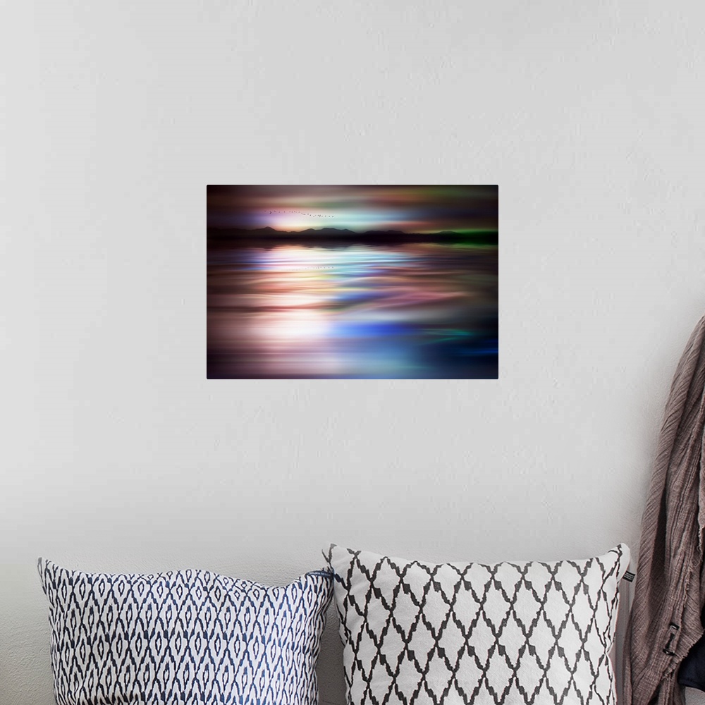 A bohemian room featuring Abstract photograph of a flock of birds flying above a dreamy, wavy body of water with a mountain...
