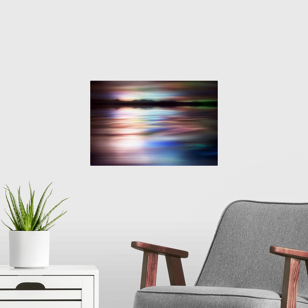 A modern room featuring Abstract photograph of a flock of birds flying above a dreamy, wavy body of water with a mountain...