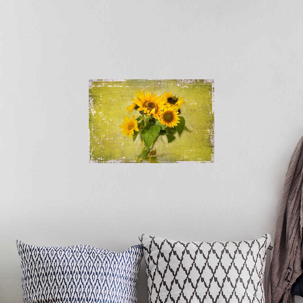 A bohemian room featuring Photograph of a bouquet of sunflowers in a glass jar on a green and white weathered background.