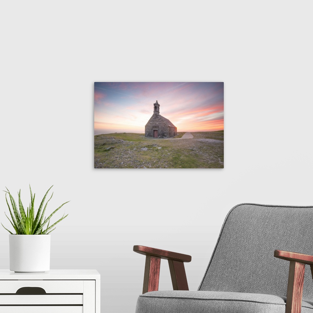A modern room featuring Pink sweet sunset in Brittany, on little Saint Michel chapel.