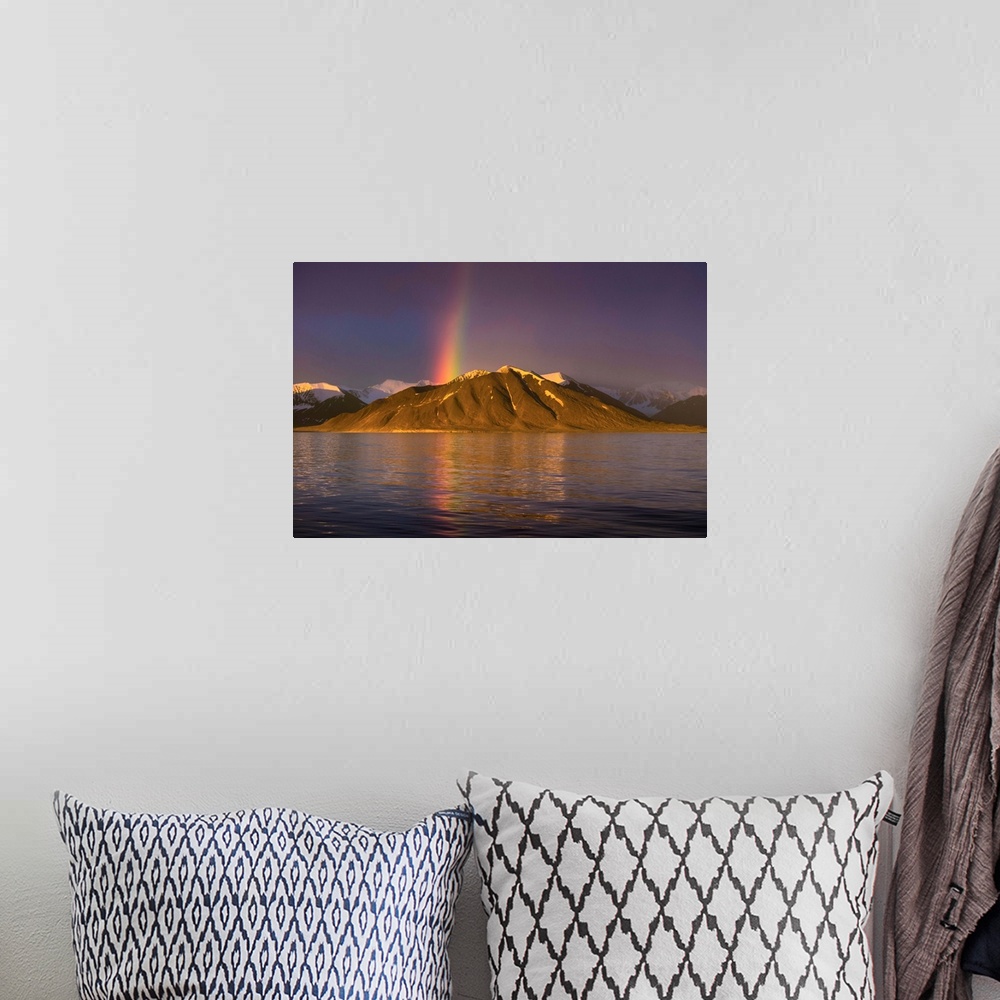 A bohemian room featuring Fine art photograph of a rainbow over a mountain on the Norwegian coast.