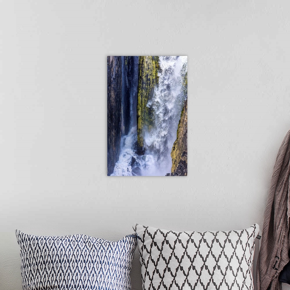 A bohemian room featuring Fine art photograph of a waterfall with mossy rocks in Svalbard, Norway.