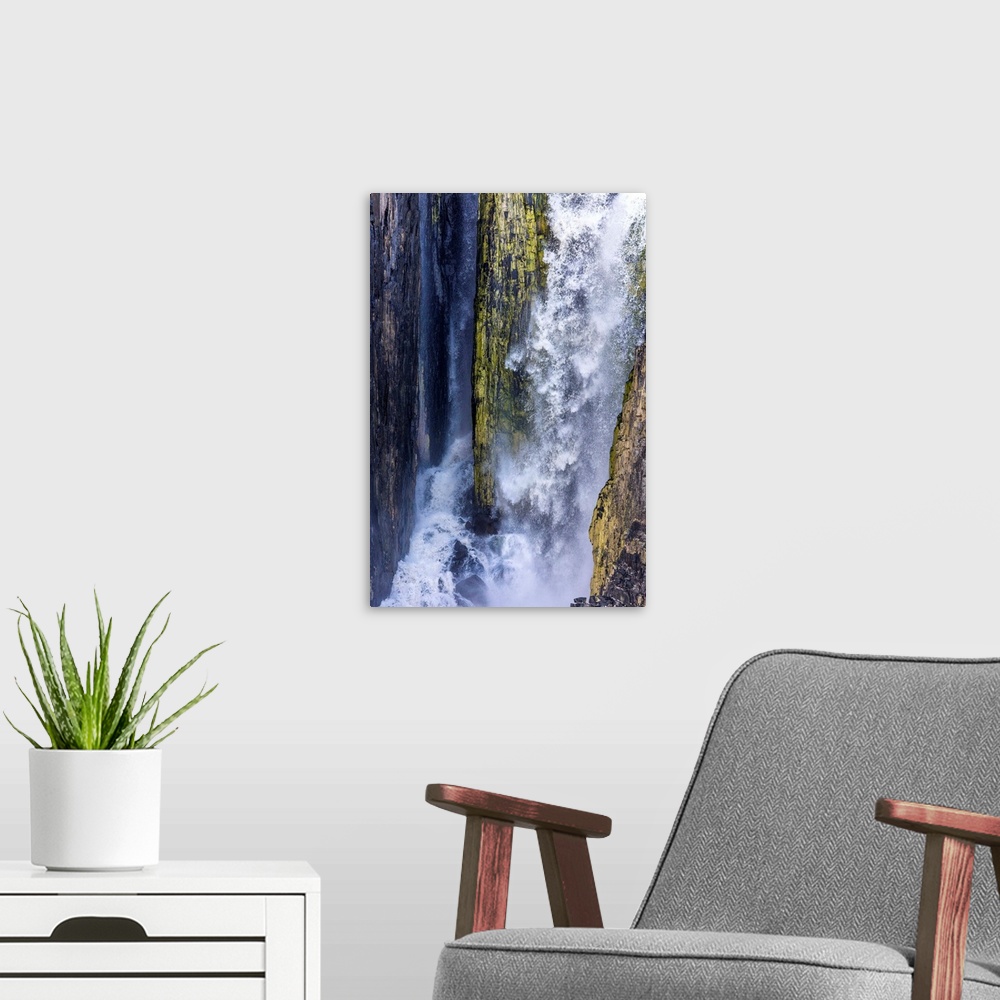 A modern room featuring Fine art photograph of a waterfall with mossy rocks in Svalbard, Norway.