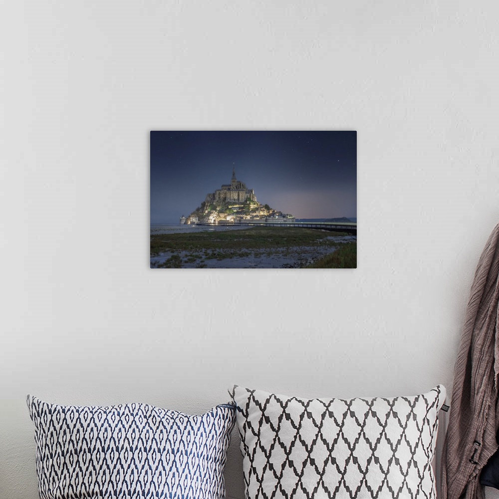 A bohemian room featuring Night shot of Mont Saint Michel in Normandy. France, Europe.