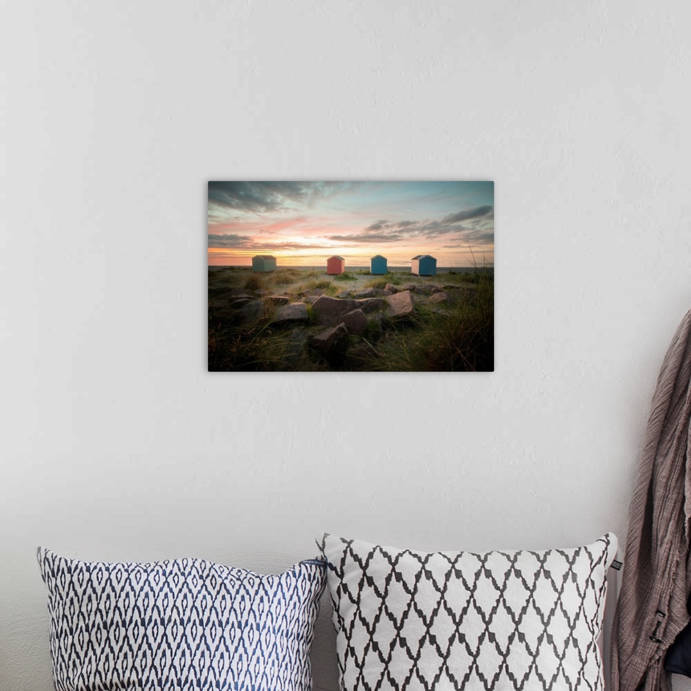 A bohemian room featuring A pink and orange sunset in Scotland on findhorn beach