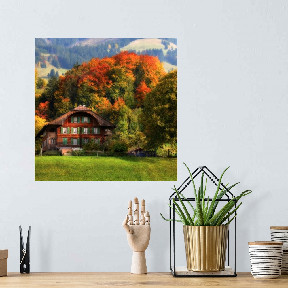 A bohemian room featuring Photograph of cabin at the bottom of a foothill with autumn colored forest in the background.