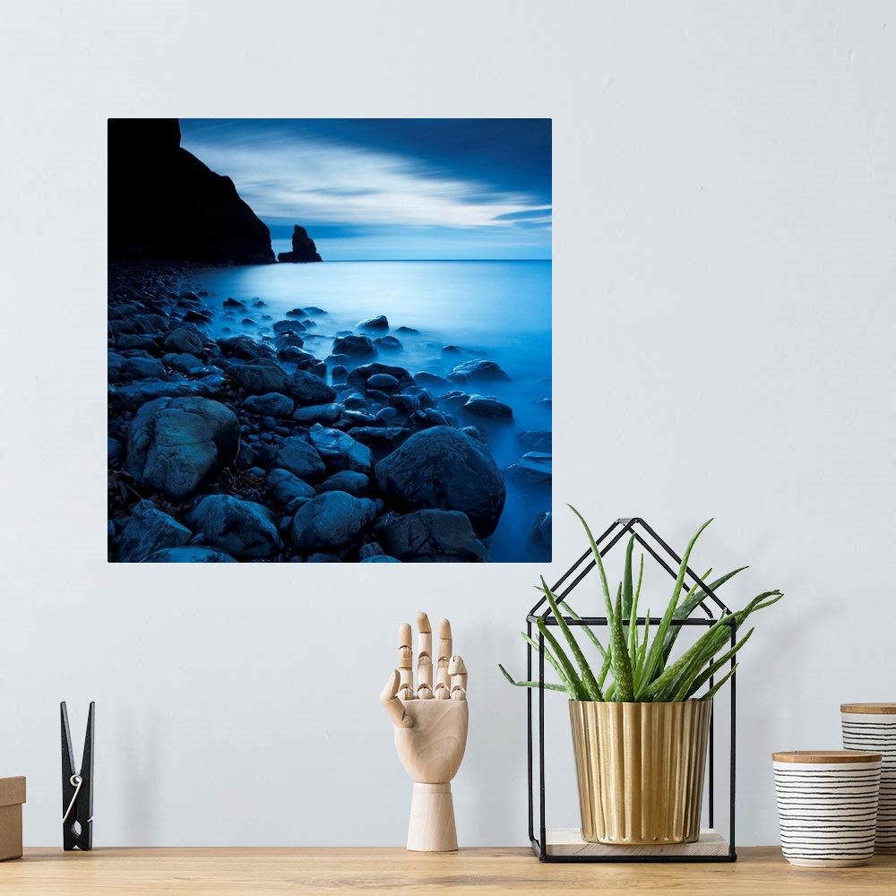 A bohemian room featuring This is a vertical landscape photograph of fog and water on rocky beach that would make great hug...