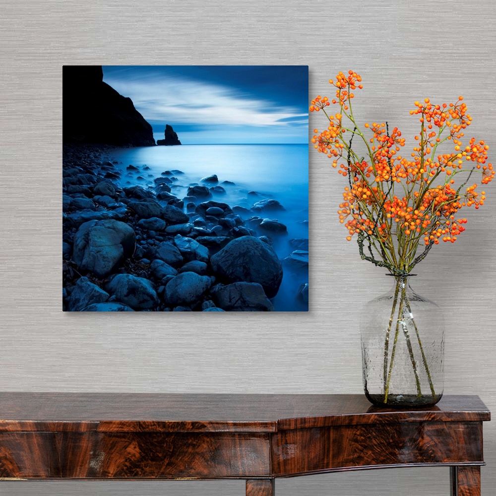 A traditional room featuring This is a vertical landscape photograph of fog and water on rocky beach that would make great hug...