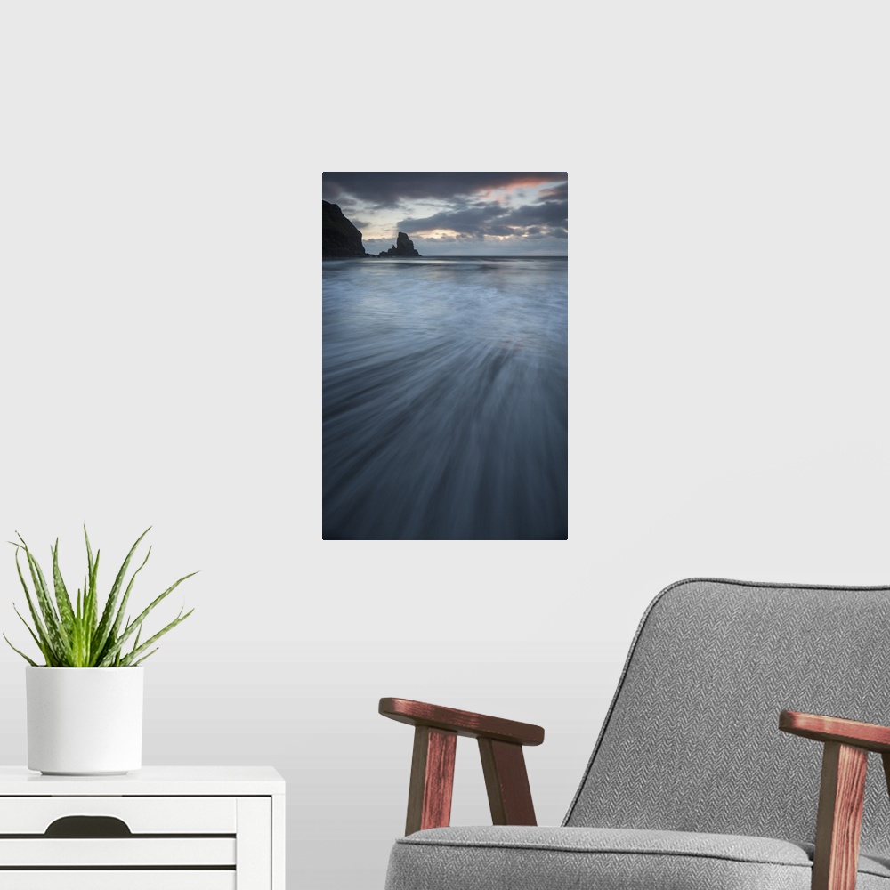 A modern room featuring A dramatic sunset seascape from Talisker Bay, Isle of Skye, Scotland in soft blue greys and pinks...