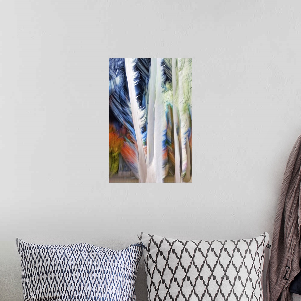 A bohemian room featuring An ICM (Intentional Camera Movement) image of a group of tall cedars in a small town in British C...