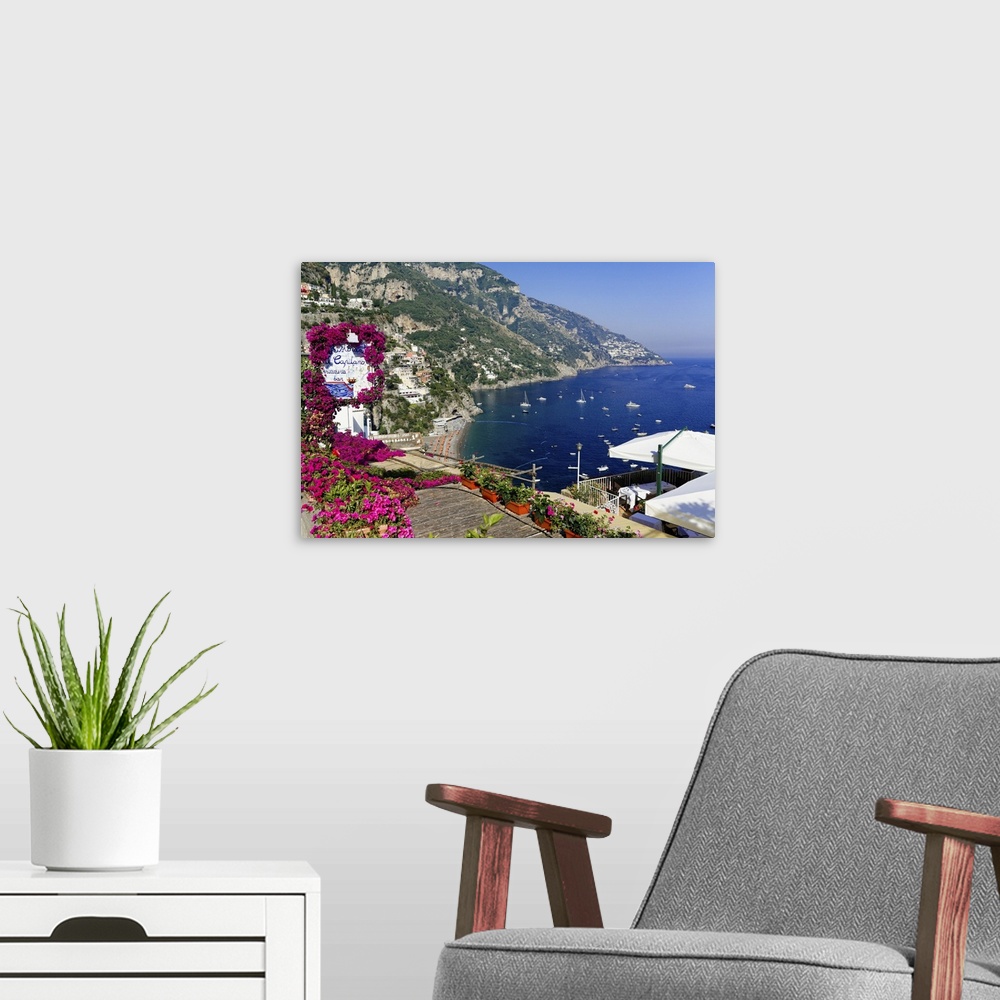 A modern room featuring High Angle View of a Beach and Coast from a Hillside Terrace, Positano