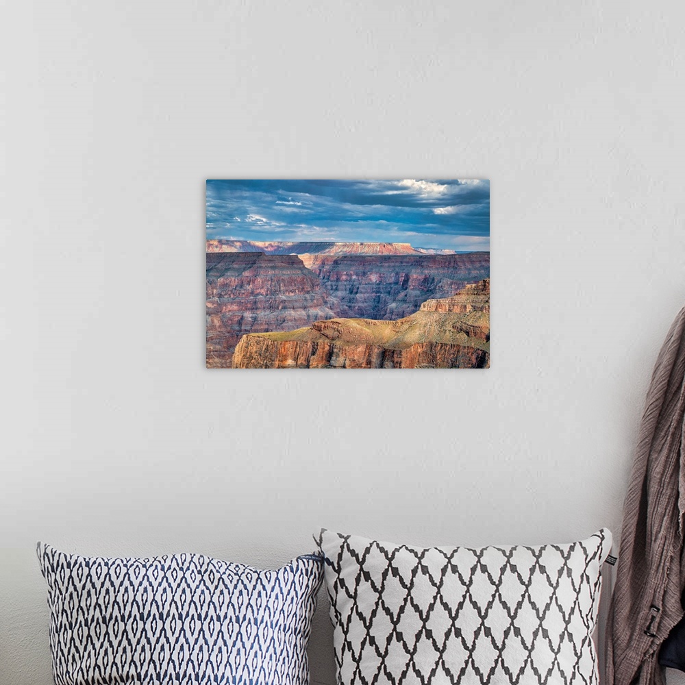 A bohemian room featuring Photograph of a beautiful canyon landscape with a blue, cloudy sky above.