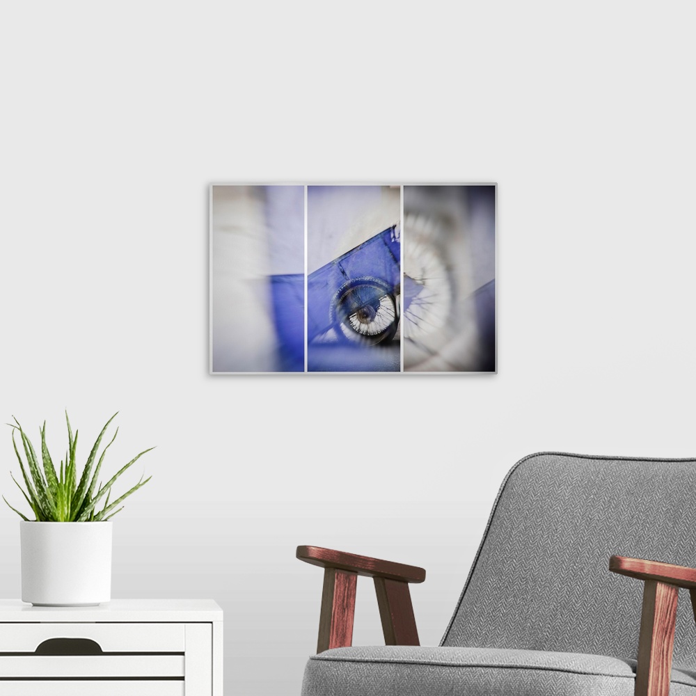 A modern room featuring Triptych image of a blue wagon created with multiple exposures.
