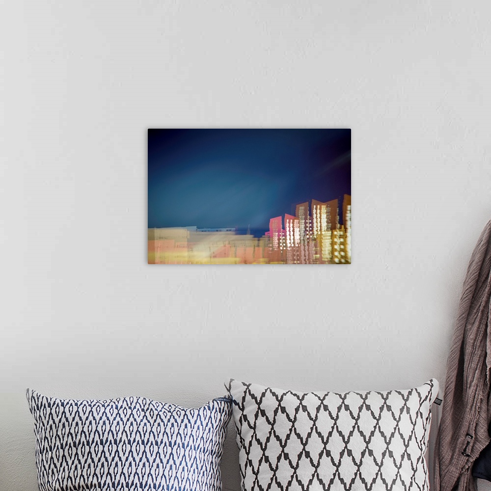 A bohemian room featuring Long exposure photograph of a city skyline with movement and distortion.