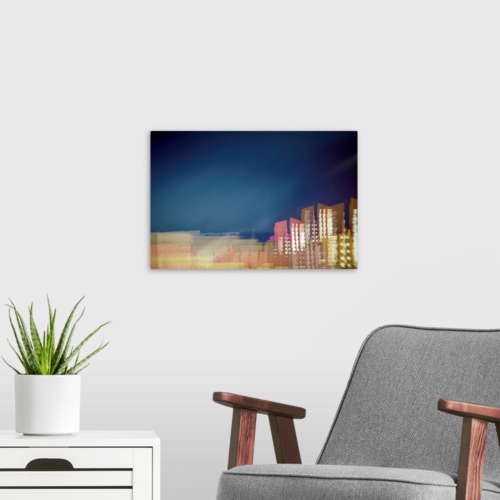 A modern room featuring Long exposure photograph of a city skyline with movement and distortion.