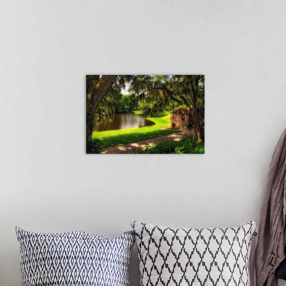 A bohemian room featuring Fine art photo of a small house near a river in a mossy forest in South Carolina.