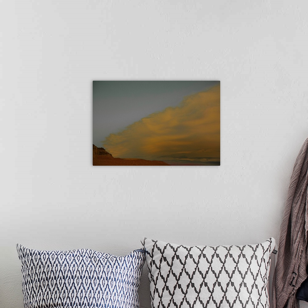 A bohemian room featuring Abstract landscape photograph representing a desert, sand, and a sandstorm.