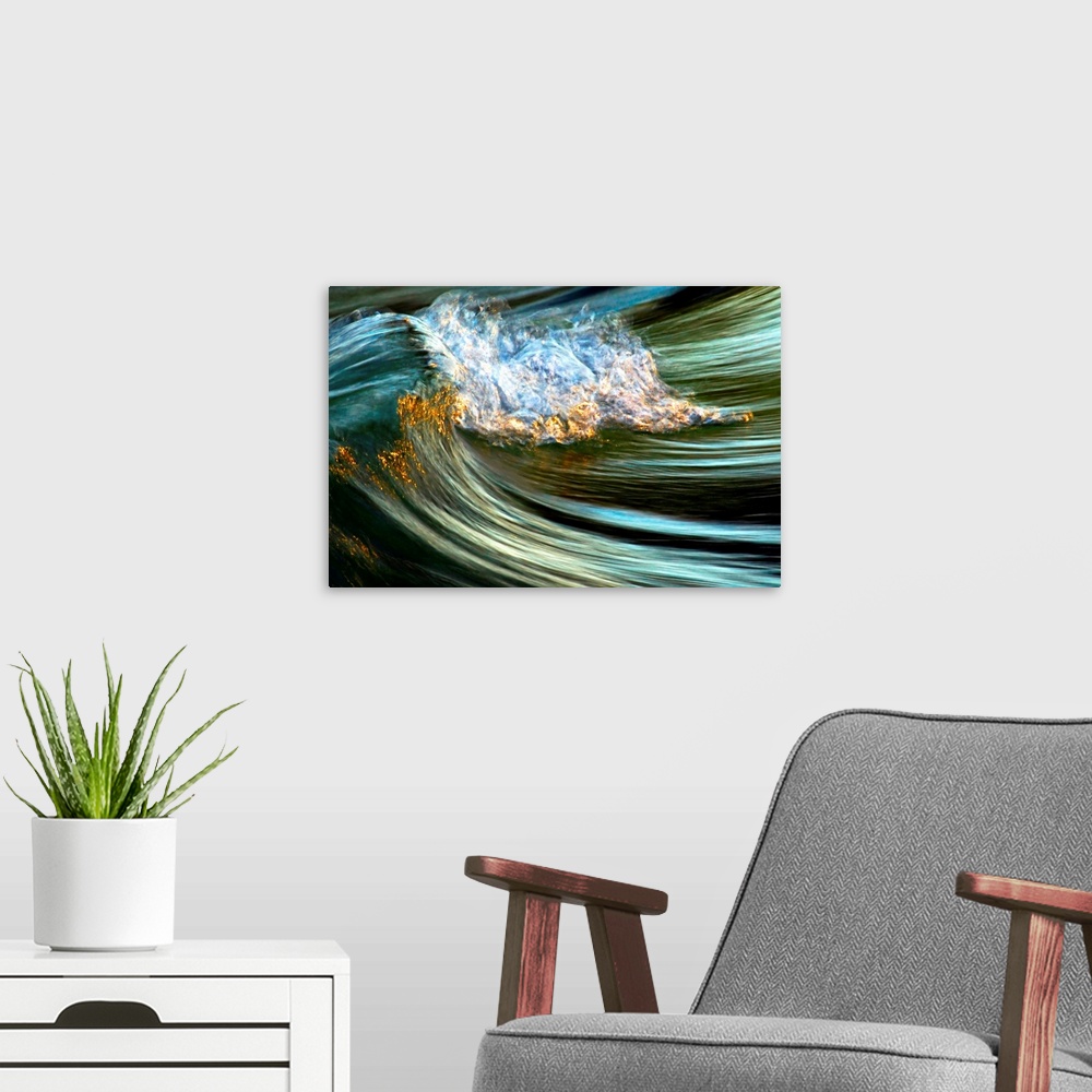 A modern room featuring Big photograph focuses on the crest of a wave as it begins to fold over and crash against itself.