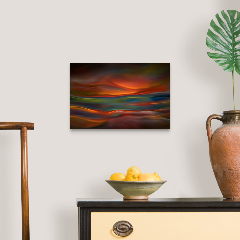A traditional room featuring Abstract photograph of blurred and blended colors and flowing lines in shades of orange and blue.
