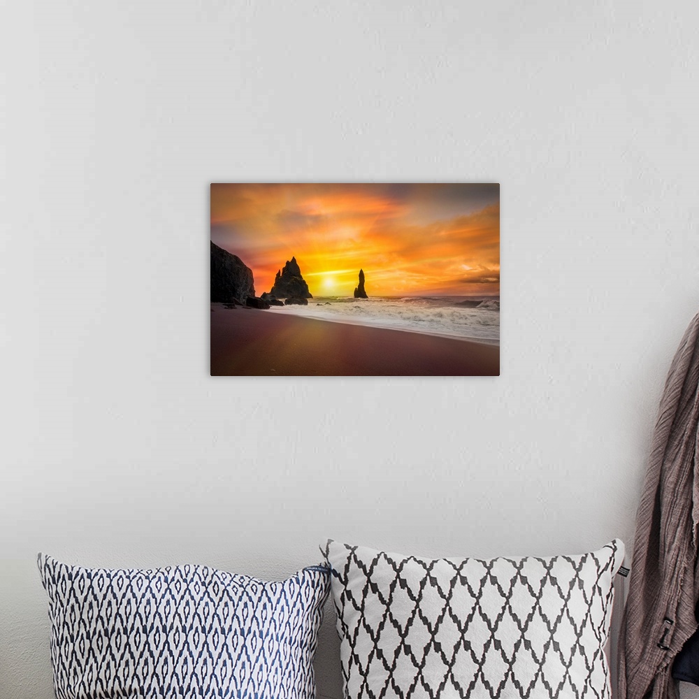 A bohemian room featuring Fine art photograph of the sun shining over a sandy beach with foamy waves.