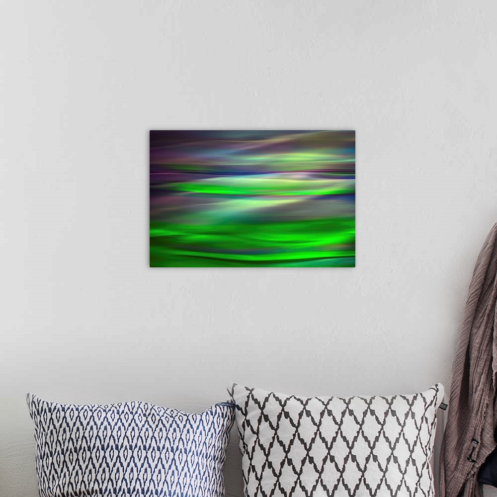 A bohemian room featuring Abstract photograph of a motion blurred landscape of vibrant colors.