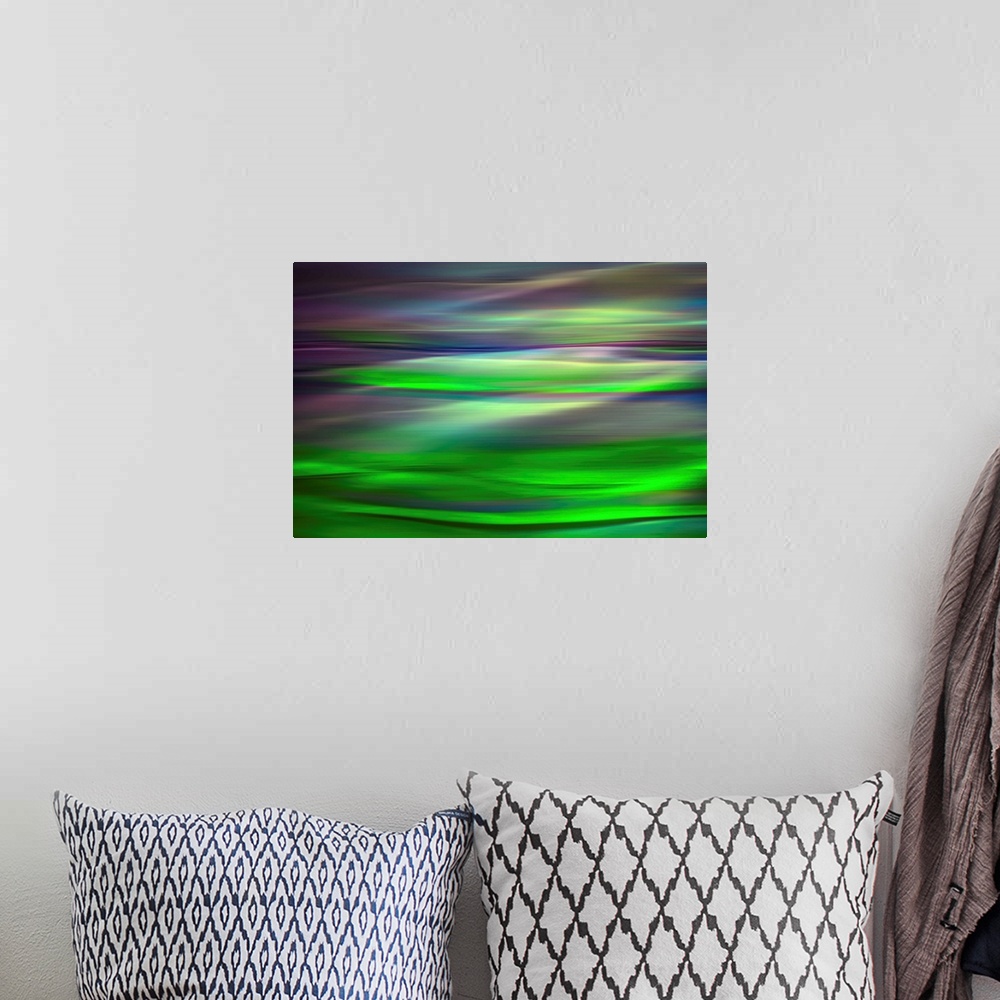 A bohemian room featuring Abstract photograph of a motion blurred landscape of vibrant colors.