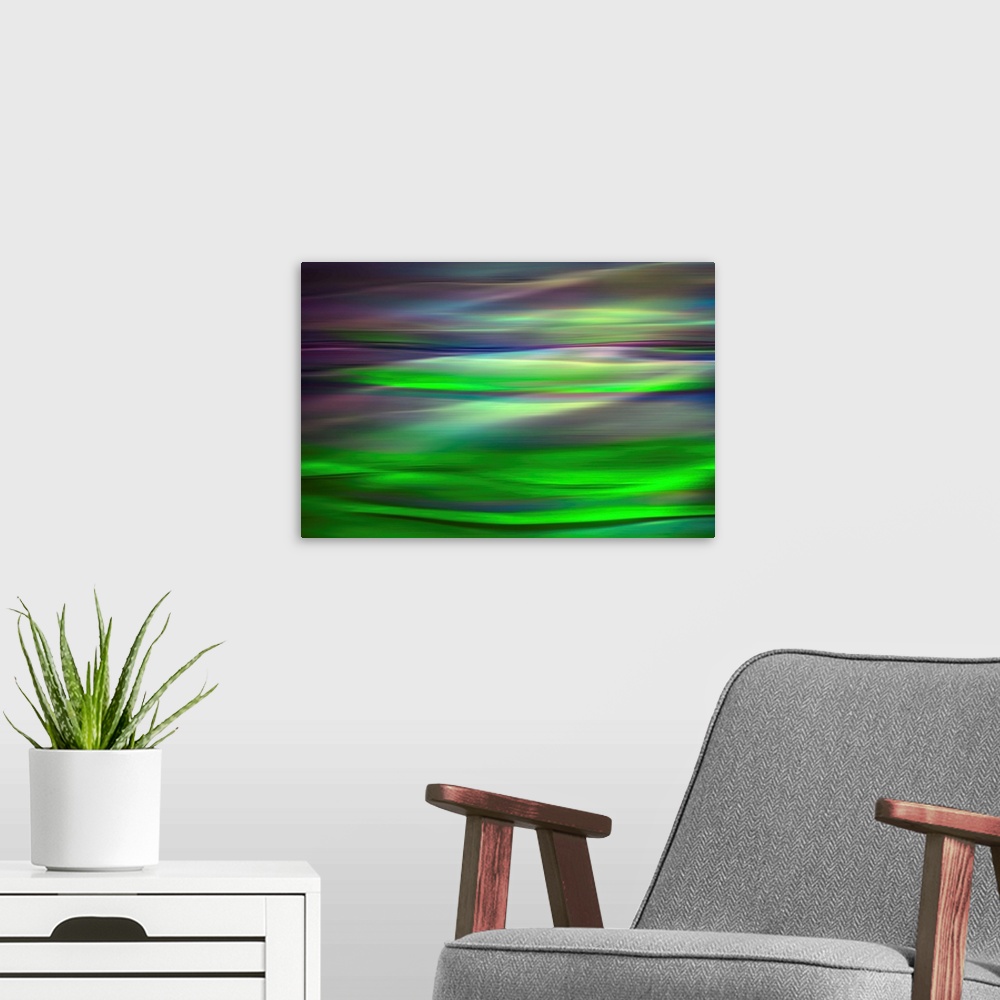 A modern room featuring Abstract photograph of a motion blurred landscape of vibrant colors.