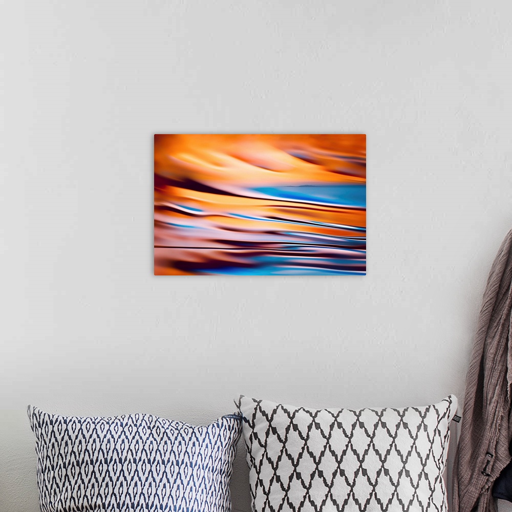 A bohemian room featuring Abstract image of a far away horizon line of land combined with a second image, a colourful close...