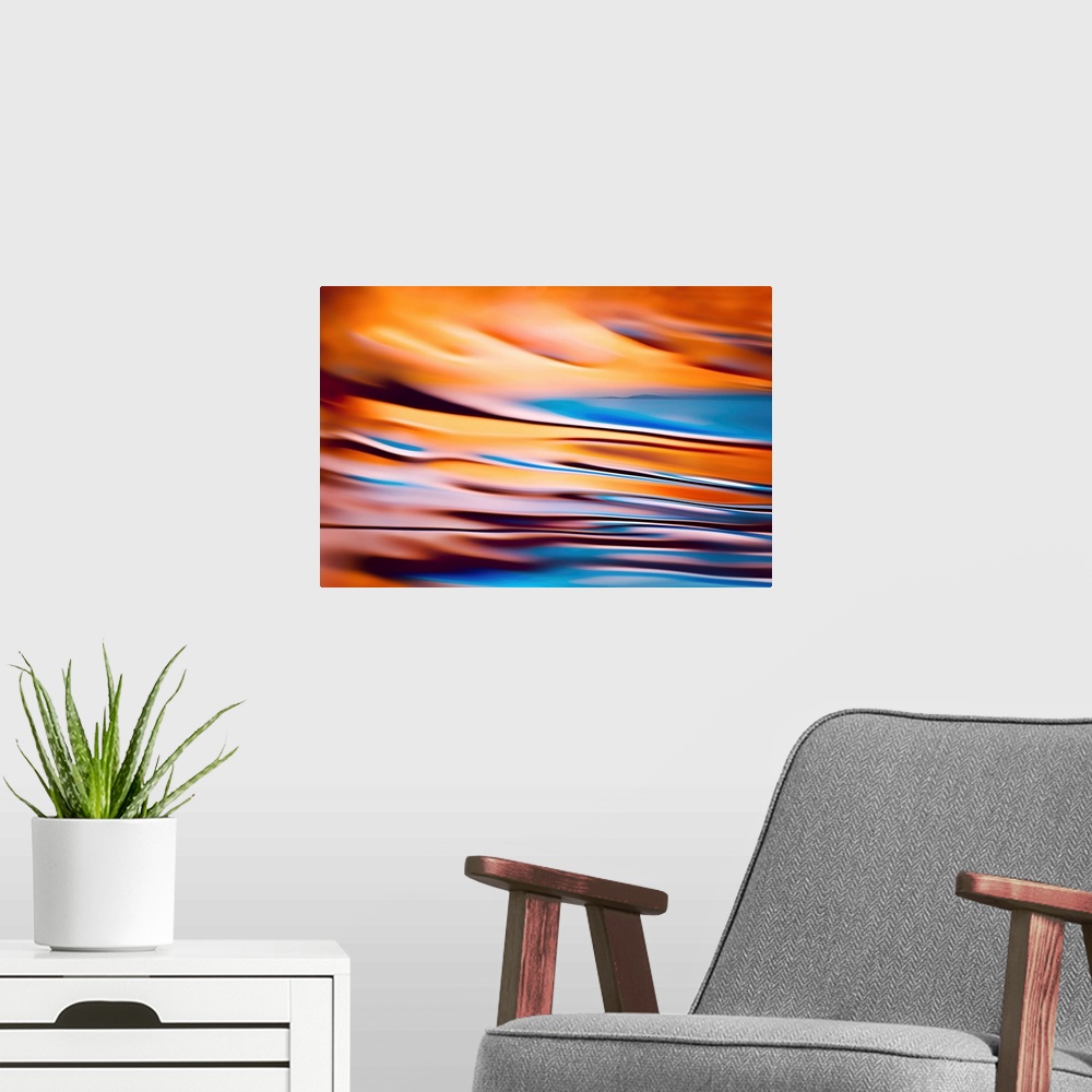 A modern room featuring Abstract image of a far away horizon line of land combined with a second image, a colourful close...
