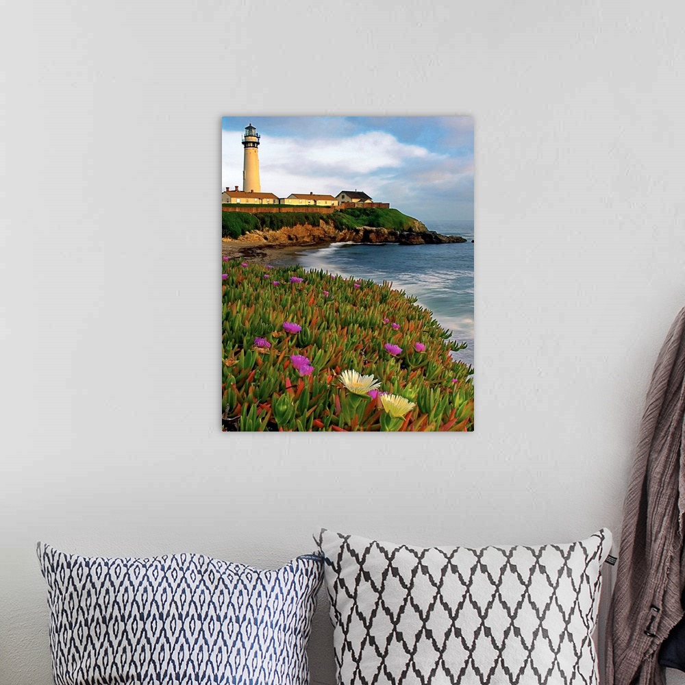A bohemian room featuring Photograph of a field of flowers at the base of a lighthouse sitting on the cliff overlooking the...