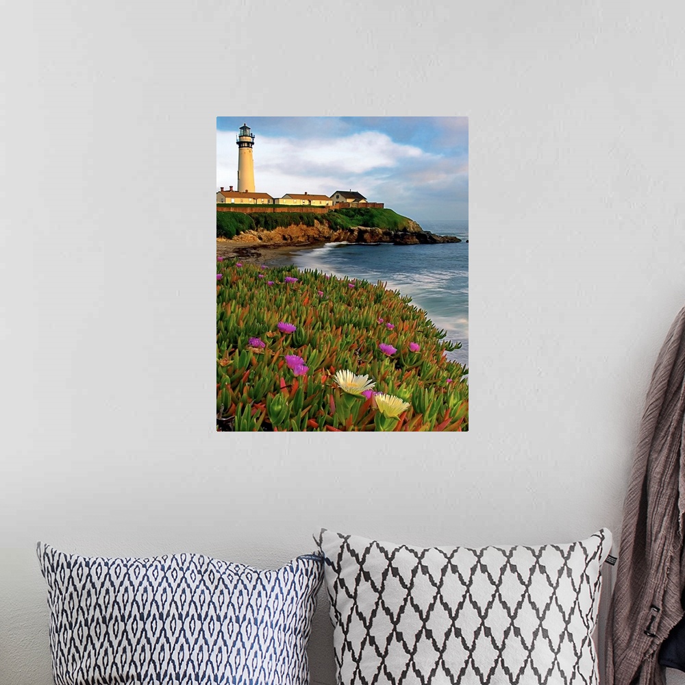 A bohemian room featuring Photograph of a field of flowers at the base of a lighthouse sitting on the cliff overlooking the...