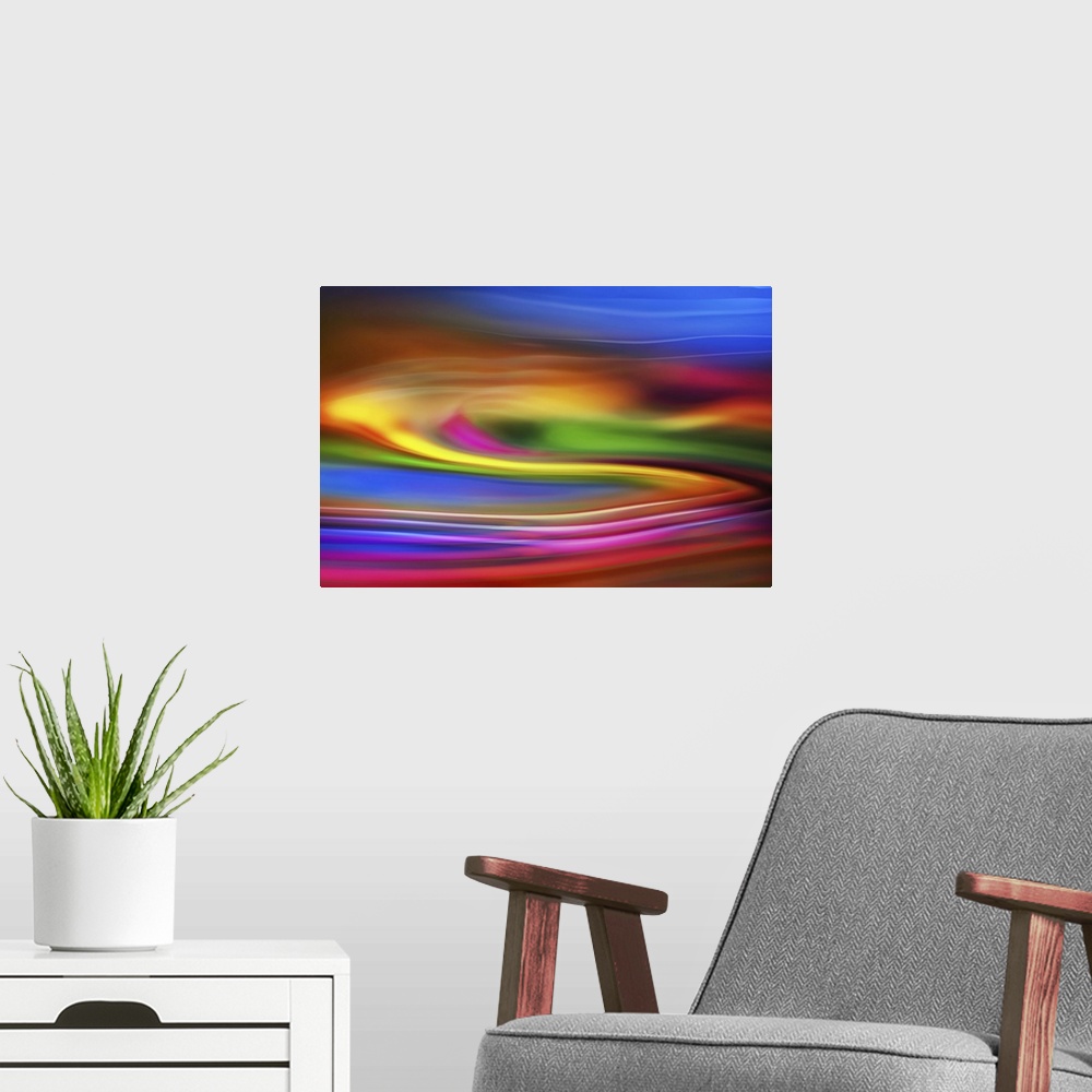 A modern room featuring Abstract photograph of blurred and blended neon rainbow colors and flowing lines.