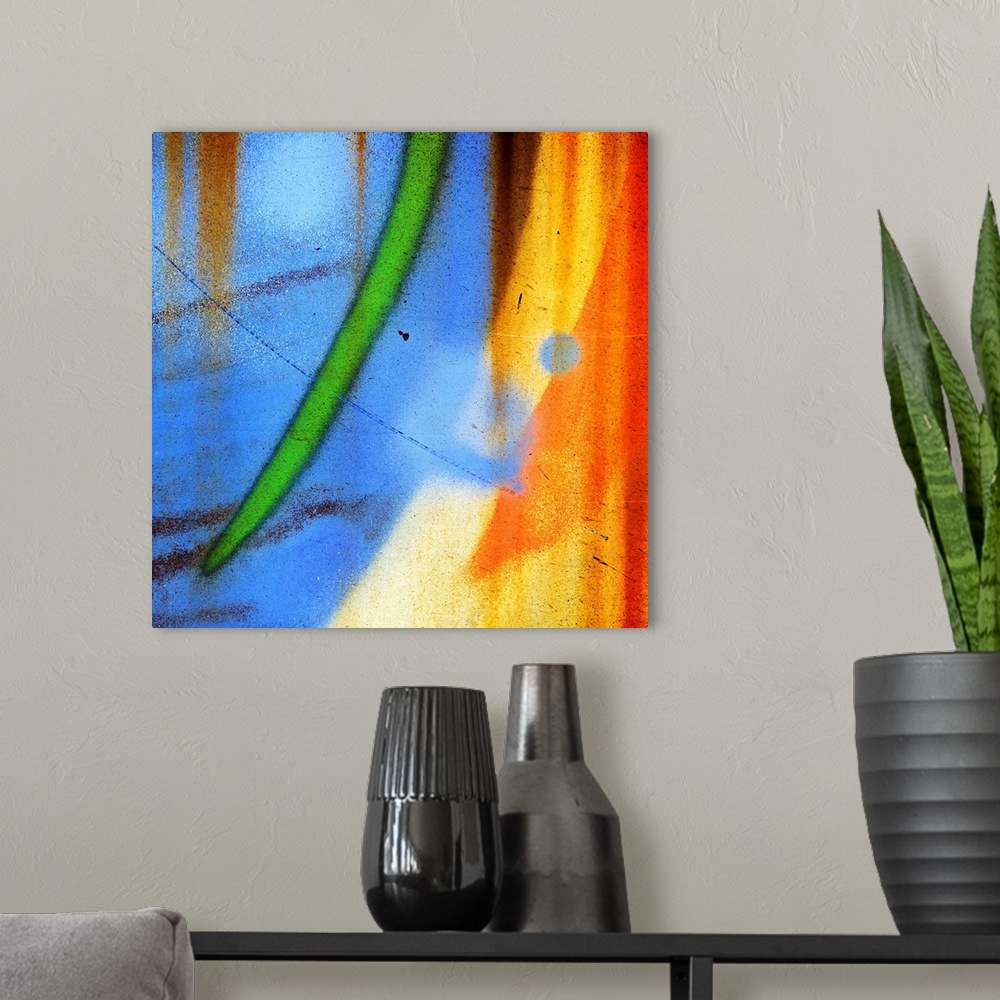 A modern room featuring Abstract artwork created from a close up shot of graffiti on a wall, with curved streaks of blue,...